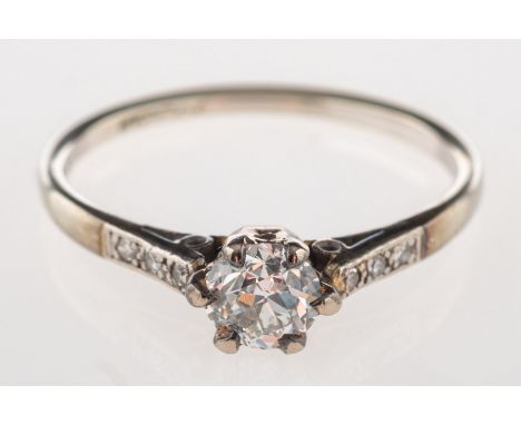 A diamond ring, claw set to the centre with an old-cut diamond, diamond approx. 0.50 carat, and three single-cut diamonds set