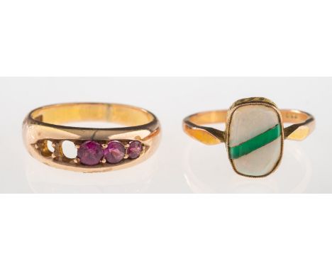 Two gemstone set rings, including a ring set with five circular-cut pink stones, possibly pink tourmaline (two loose from set