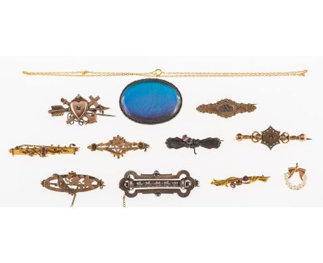 A mixed group of Victorian and other jewellery, including five ornate mourning brooches, some stone set, either marked 9ct or
