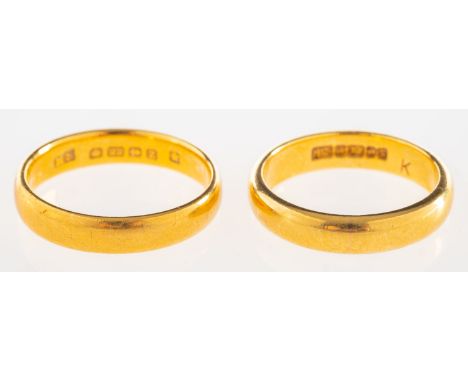 Two 22ct gold wedding bands, both UK hallmark, one size L1/2, one size K to K1/2, total gross weight 9.7grams, (2).