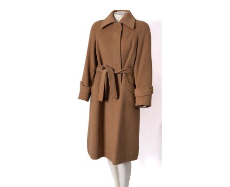 Jaeger, London a lady's tan wool overcoat with waist belt and silk lining