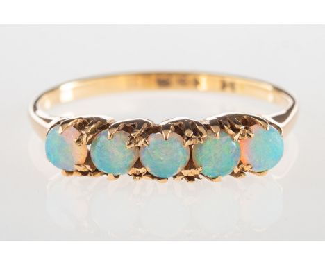 An antique five stone opal ring, claw set with five opal cabochons, indistinct mark, size L1/2 to M, 1.8grams.