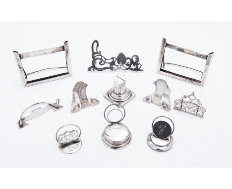A mixed group of silver menu holders and stands including; a pair of Birmingham easel holders by Ahronsberg Brothers, two pho