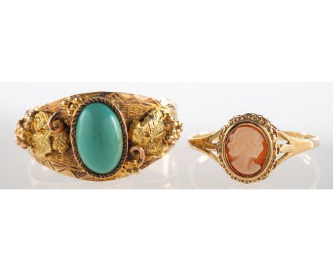 An Arizona Gold turquoise ring and a cameo ring, an ornate ring set to the centre with an oval turquoise cabochon with raised