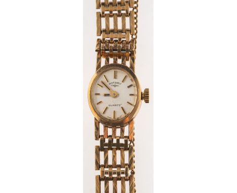 Rotary, a 9ct gold lady's wristwatch the oval silvered dial signed Rotary, Quartz and having raised baton numerals and matchi
