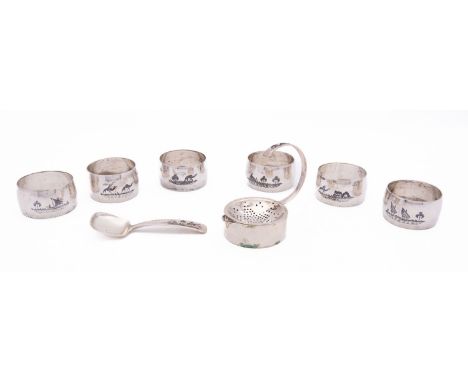 A set of six mid 20th century Iraqi niello decorated silver napkin rings, not marked, decorated with camels and dhows, with a