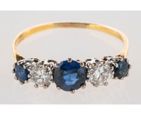 A five stone sapphire and diamond ring, claw set with three circular-cut sapphires and two brilliant-cut diamonds, sapphires 