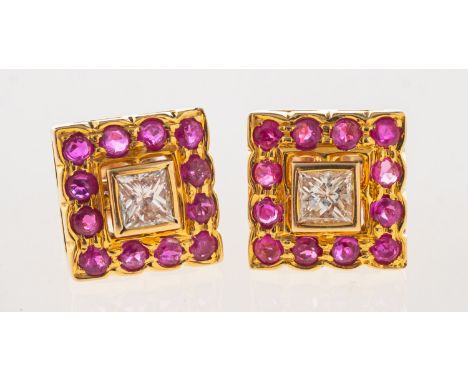 A pair of ruby and diamond earrings, of square form and each set with a central princess-cut diamond, with a surround of circ