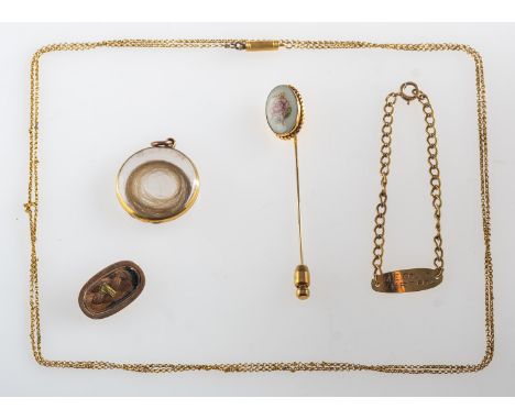 A mixed group of jewellery, including a stick pin with a floral motif, marked Lenox, 12K G.F. (gold plated); a mourning brooc