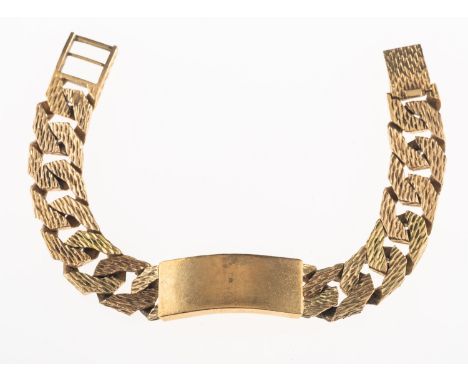 A heavy identity bracelet, with plain central identity panel and textured flat curb links, ladder clasp, partial UK hallmark 