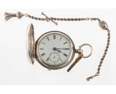 A silver full hunter pocket watch the movement having an engraved balance cock to the lever escapement with the white enamel 
