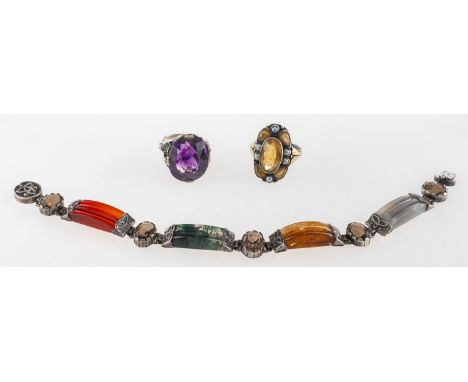 A Scottish gem-set bracelet and two gem-set rings, a Scottish Celtic designed bracelet set with five oval-cut smokey quartz a