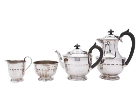 A George V four piece silver tea service by Viner's Ltd, Sheffield 1832, comprising; a tea pot, hot water pot, milk jug and s