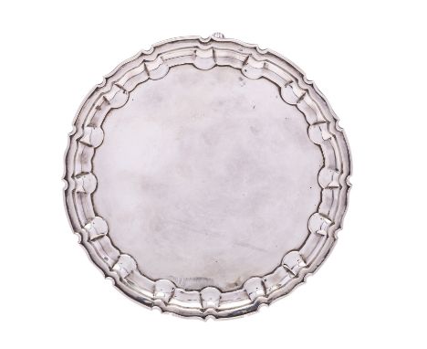 An Edward VII silver waiter by William Hutton & Sons Ltd, London 1905, of circular form, with piecrust rim and border, raised