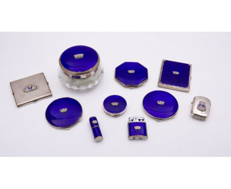 A group of silver and enamel Royal Naval compacts including; four compacts, a silver and glass dressing table powder bowl, a 