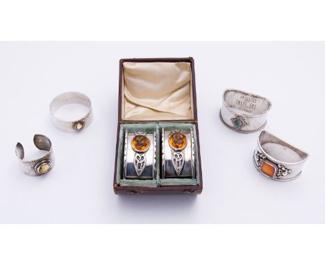 A cased pair of Arts and Crafts silver napkin rings by H.M.J possible over struck, Birmingham 1929, of oval form with Celtic 