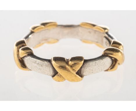 Tiffany & Co. A signature 'Kiss' ring, marked T&Co, 925, 750, Italy, size L to L1/2, 4.8grams.