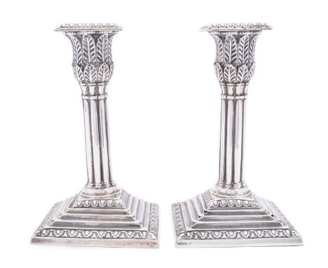 A pair of Victorian silver dwarf candlesticks by Hawksworth, Eyre & Co, Sheffield, 1874, Corinthian column, detachable square