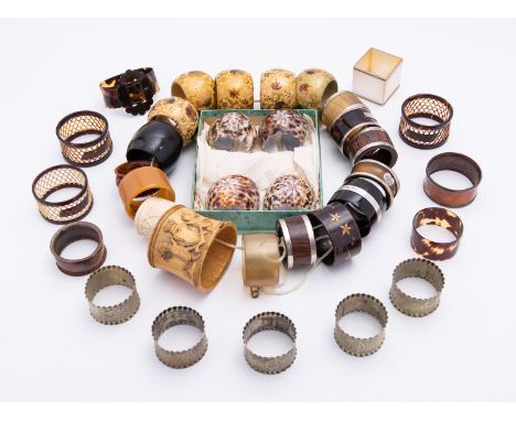 A mixed group of napkin rings including; an Arts and Crafts horn, silver and inset stone ring by J Collyer & Co Ltd, Birmingh