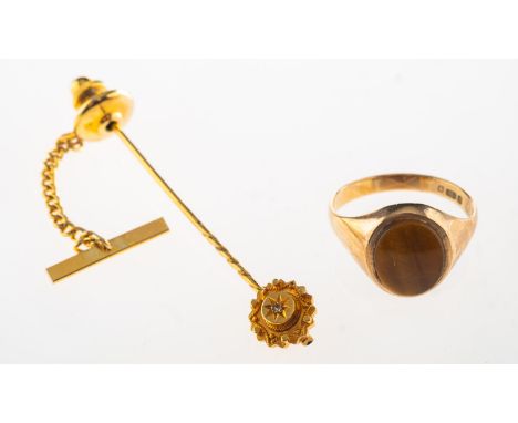 A 9ct gold tiger's eye signet ring and a stick pin, a 9ct gold signet ring set with an oval plaque of tiger's eye, UK hallmar