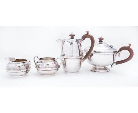 A matched George V four piece silver tea service Charles Boyton & Son Ltd comprising; a hot water jug, two handled sugar bowl