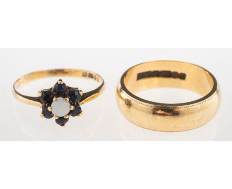 Two 9ct gold rings, including a 9ct gold wedding band, UK hallmark, size H1/2, 4.0grams; and a 9ct gold cluster ring set with