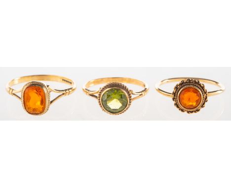 A group of three 9ct gold gem-set rings, including a 9ct gold ring set with an oval-cut fire opal, UK hallmark, size O1/2, 1.