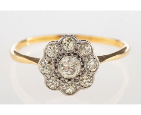 An antique diamond daisy ring, a ring in the form of a flowerhead, set with old-cut diamonds, marked 18ct & Pt, size O to O1/