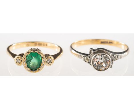 A group of two rings, including a 9ct gold ring set with an oval green paste stone (damaged) and set each side with a small d