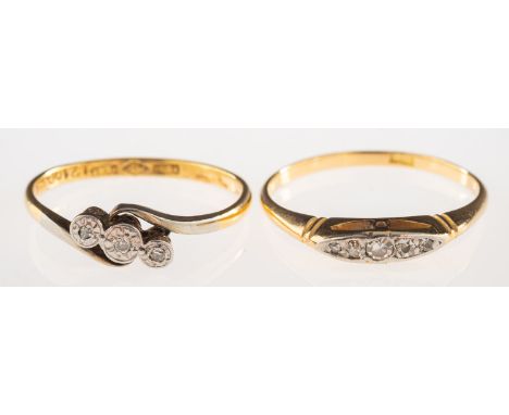 Two diamond set rings, including a ring set with five graduated old-cut diamonds, marked 18K, size R1/2, 2.2grams; and a thre