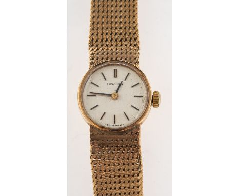 Longines :&nbsp; &nbsp;A 9ct gold vintage wristwatch, a Longines mechanical wind wristwatch, silvered dial with black hourly 