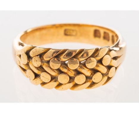 A Victorian 18ct gold keeper ring, with a braided section to the front, UK hallmark, size N, 6.9grams.