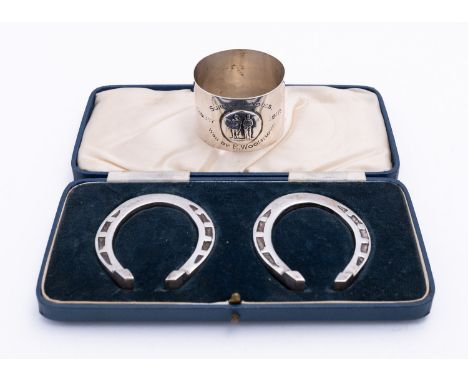An unusual lady's Bisely shooting trophy napkin ring by Elkington & Co Ltd, Birmingham 1911, decorated with applied NRA emble