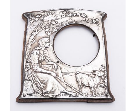 An Arts and Crafts silver picture photograph frame by Charles S Green & Co Ltd, Birmingham 1905, of a goat herd and browsing 
