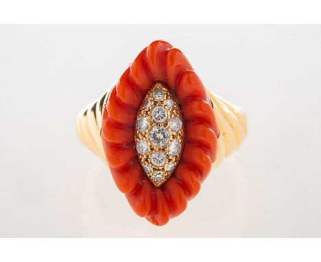 A 1970's 18ct gold coral and diamond cocktail ring, of navette form and set to the centre with brilliant-cut diamonds with a 