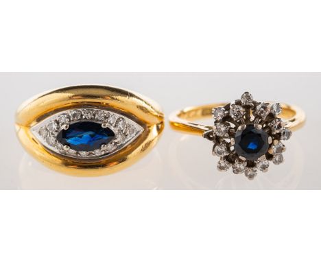 A group of two sapphire and diamond rings, including a ring set with a central marquise-cut sapphire and a surround of single