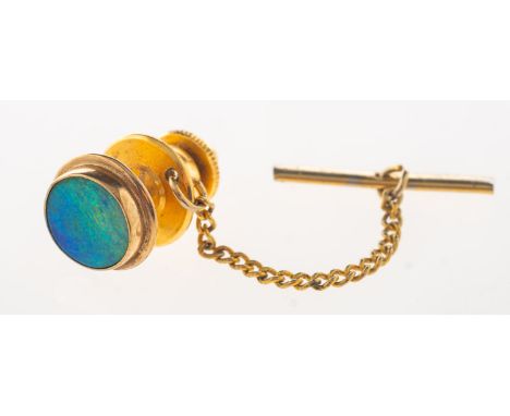 A black opal tie pin, the back of the pin indistinctly marked 9ct, 0.6grams; with a gilt pin fastener with chain and t-bar.