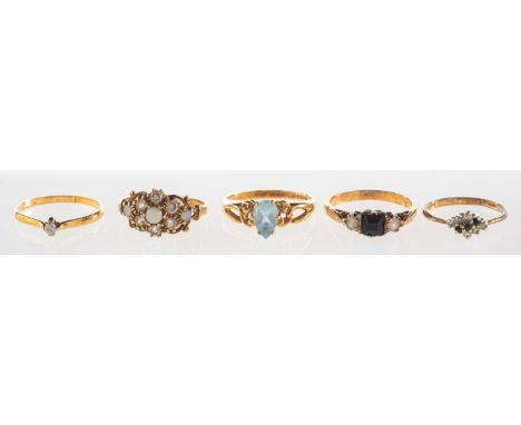 A group of five rings, including a 9ct gold ring set with three opal cabochons and paste stones, UK hallmark, size N, 2.2gram