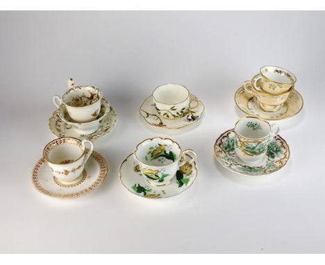A collection of cups and saucers, early-mid 19th century English, including a Spode example printed with green vignettes of b