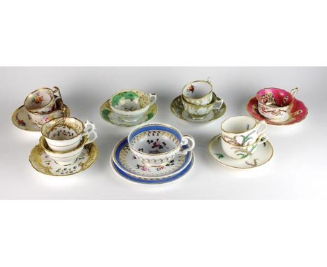 Assorted English cups and saucers, 19th century, comprising a Royal Worcester trio painted with scrolling green foliage below