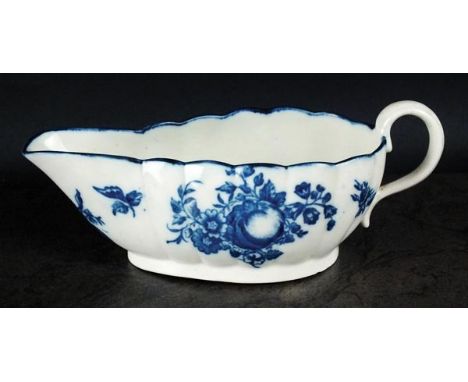 A Caughley sauce boat, circa 1780-85, of wide reeded form, with scroll handle and printed in underglaze blue with the Apple p