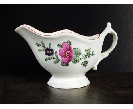 A Caughley polychrome cream boat or 'gadroon boat', Chamberlain decorated, circa 1780-85, with raised, overlapping strap hand