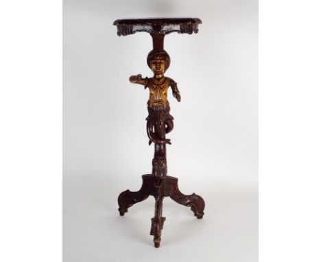 A late 19th/early 20th century Venetian walnut Blackamoor style pedestal occasional table, the serpentine top on a figural co