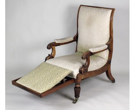 An early Victorian mahogany adjustable armchair with folding foot rest stamped 'R. Daws, patent' with rectangular padded back
