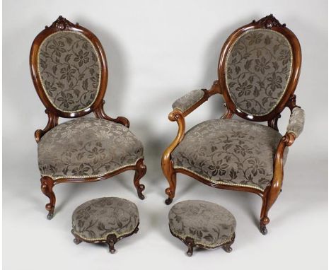 An early Victorian walnut salon suite comprising of serpentine sofa, lady's and gent' s easy chairs, six side chairs, and two