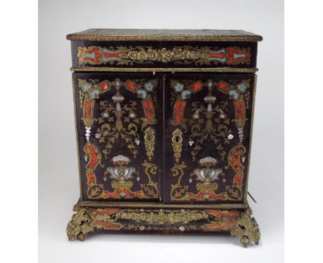 A late 19th century French boulle style table top desk / stationary cabinet, overall decorated with scrolling leaves with mot