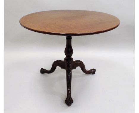 A George III and later mahogany tilt top supper table, the circular top on a bird cage block and baluster turned column and t