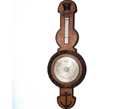 A LARGE VICTORIAN ROYAL NAVAL BAROMETER banjo form, the carved oak body with rope-twist border, surmounted by a Victorian cro
