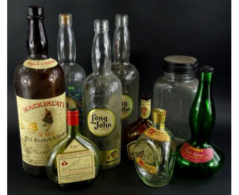 A collection of whisky and other bottles, to include a large bottle of Mackinlay's three bottles of Long John, Dimple Twelve 