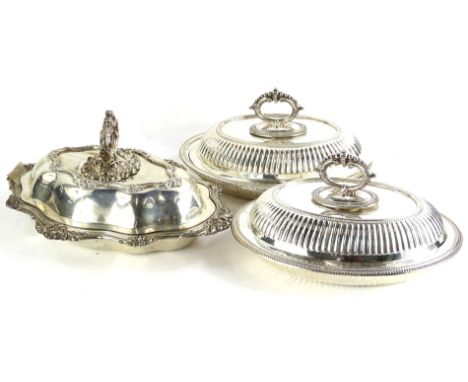 Three silver plated tureens, to include a pair, each with a beaded handle and gadrooned borders and another with rococo scrol